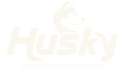 The image shows the word "Husky" in bold, stylized font with a curved line above the "H," evoking the strength and durability often sought in concrete resurfacing.